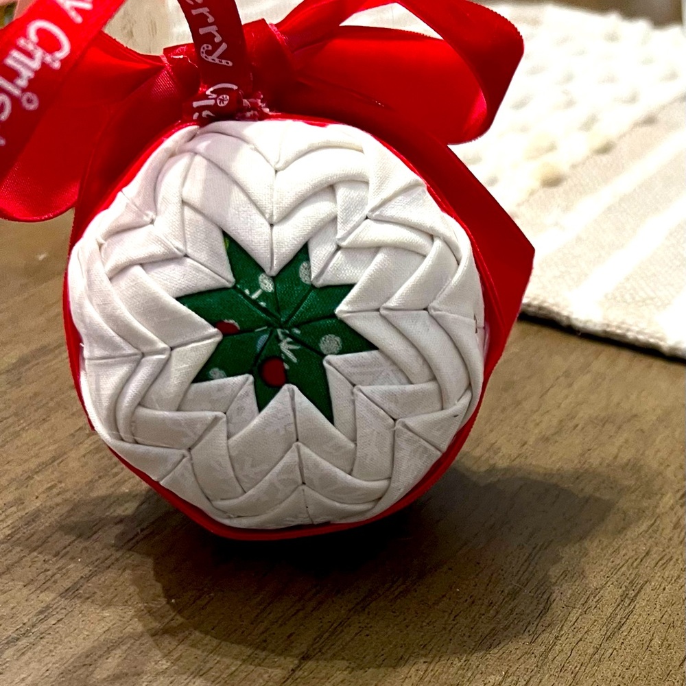 Hand made quilted Christmas ornament. Beautiful colors and pattern